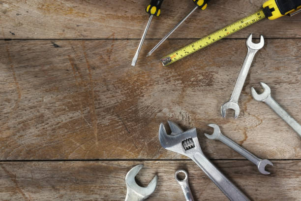 istock Tools supplies on blank wooden background 690535808