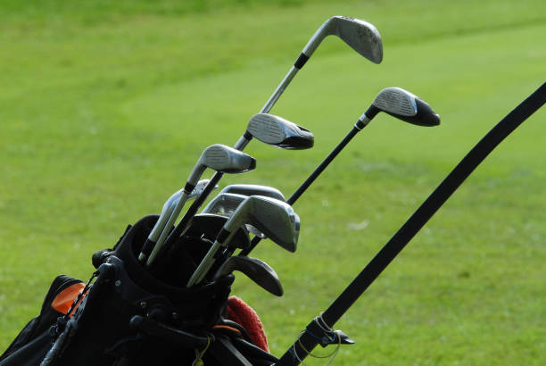 istock Golf Clubs green , bag on the  fairway 690545466