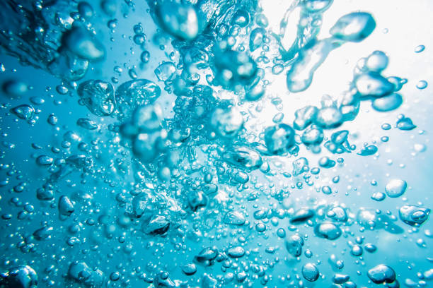 istock Water bubbles in underwater in blue ocean, water texture. 690545526