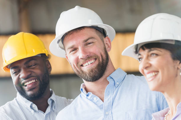 istock Group of workers wearing hardhats 690554628