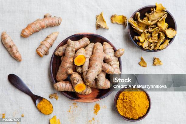 Fresh And Dried Turmeric Roots In A Wooden Bowl Stock Photo - Download Image Now - Turmeric, Antioxidant, Aromatherapy