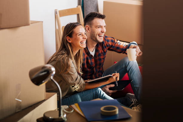 istock Young people happy about their new place 690563772