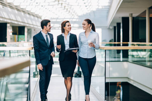 istock Female business leader with her team 690573906