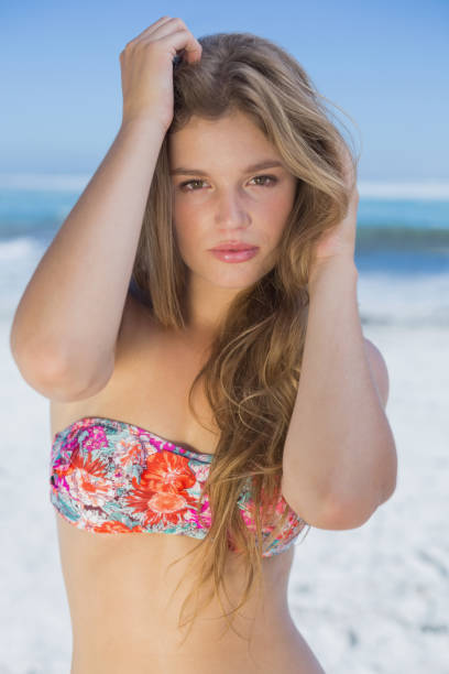 istock Beautiful happy blonde on the beach 690586652