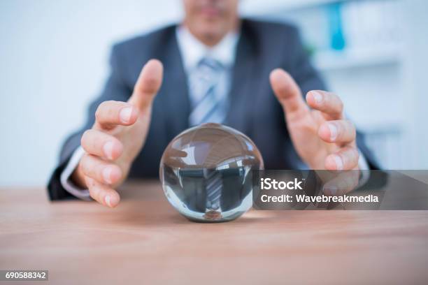 Businessman Forecasting A Crystal Ball Stock Photo - Download Image Now - 40-49 Years, 45-49 Years, Adult