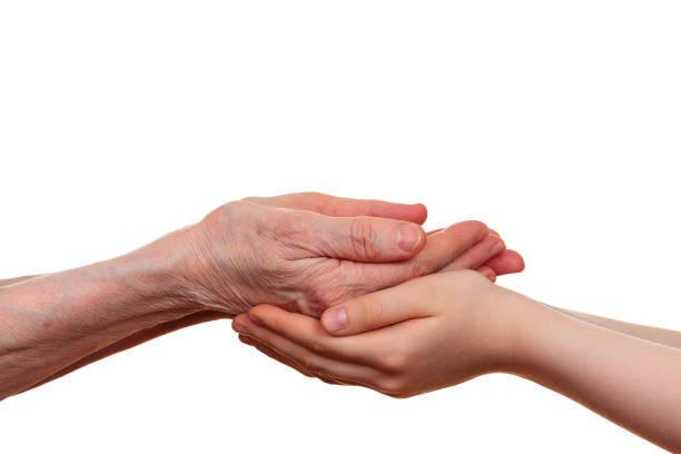 istock Old and young holding hands of each other 690592404