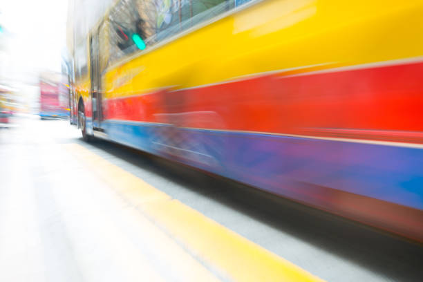 istock Motion blurred Hong Kong bus in traffic 690602946
