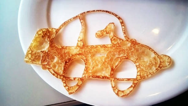Unusual pancake for a child in the form of a car Unusual pancake for a child in the form of a car bunny pancake stock pictures, royalty-free photos & images