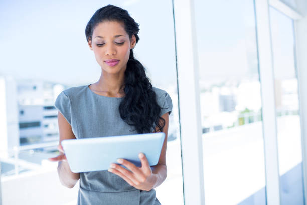istock A focused businesswoman using digital tablet 690617266