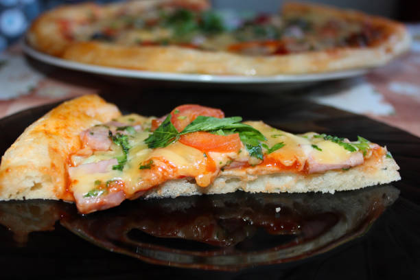 istock appetizing pieces of pizza 690617514
