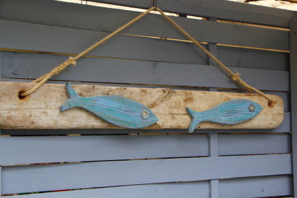 istock Decorated driftwood on a stockade 690620112
