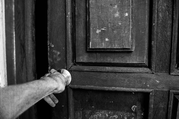 istock Hand On Doorknob,horizontal, Black And White 690620594