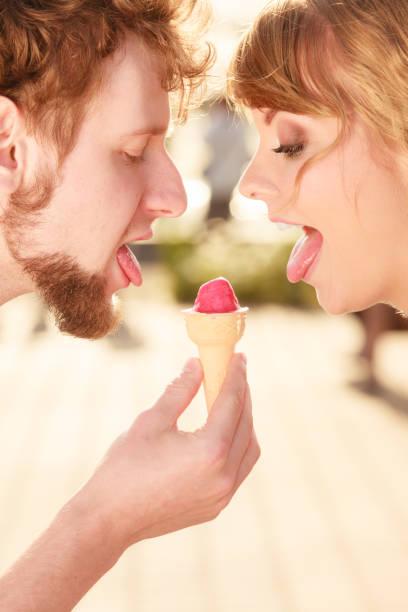 istock young couple eating ice cream outdoor 690626662