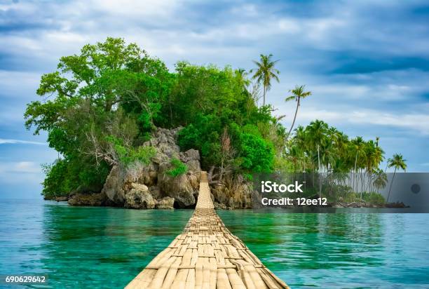 Bamboo Hanging Bridge Over Sea To Tropical Island Stock Photo - Download Image Now - Island, Tropical Climate, Beach