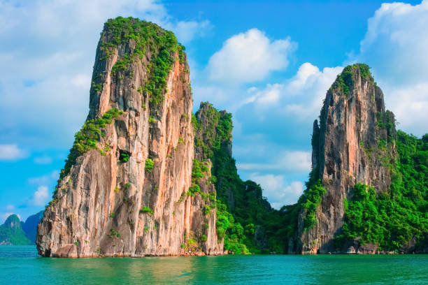 Scenic view of rock islands in Halong Bay, Vietnam Scenic view of rock island in Halong Bay, Vietnam, Southeast Asia. UNESCO World Heritage Site. Mountain islands at Ha Long Bay. Beautiful landscape Popular asian landmark famous destination of Vietnam gulf of tonkin photos stock pictures, royalty-free photos & images