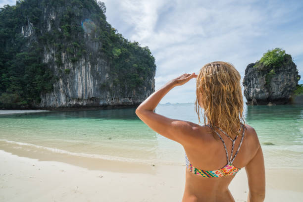 istock Blond girl enjoying exotic vacations in Thailand 690630220