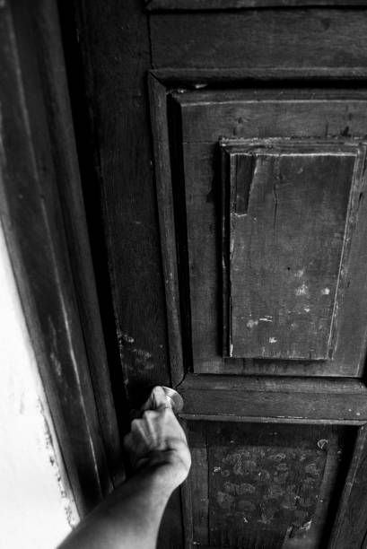 istock Hand On Doorknob, Vertical Black And White 690632634