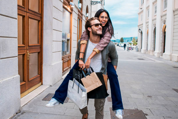 istock cheerful young couple in shopping 690635994