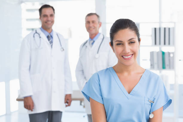 istock Nurse and doctors smiling at camera 690636584