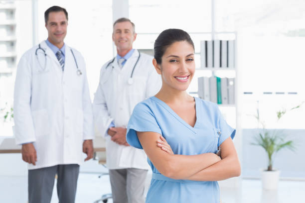 istock Nurse and doctors smiling at camera 690636630