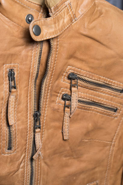 istock Light brown leather jacket. Beige color leather jacket on hanger 690636922