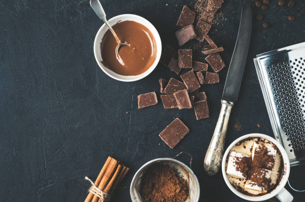 istock Cocoa, coffee and chocolate chips on dark concrete background.  Baking or cooking concepts 690648006