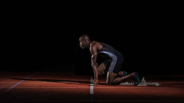 istock African-American athlete preparing at starting line 690648618