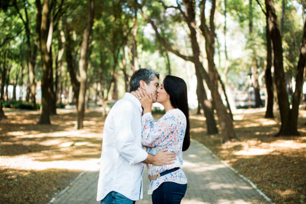 istock Loving mature couple standing and kissing 690651122