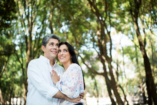 istock Cheerful mature couple embracing and looking up 690651472