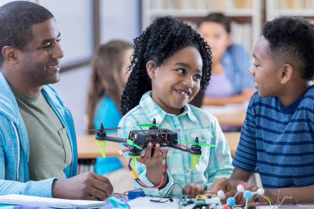istock Siblings build drone together at school 690657092