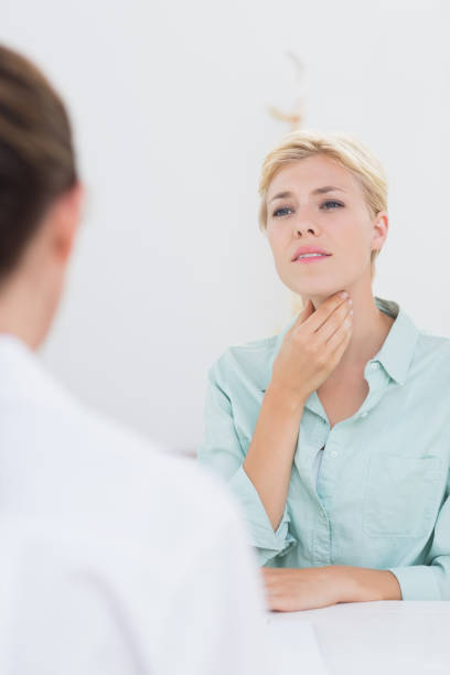 istock Patient with sore throat visiting doctor 690665010