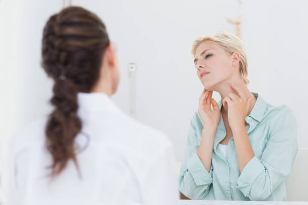 istock Patient with sore throat visiting doctor 690665030