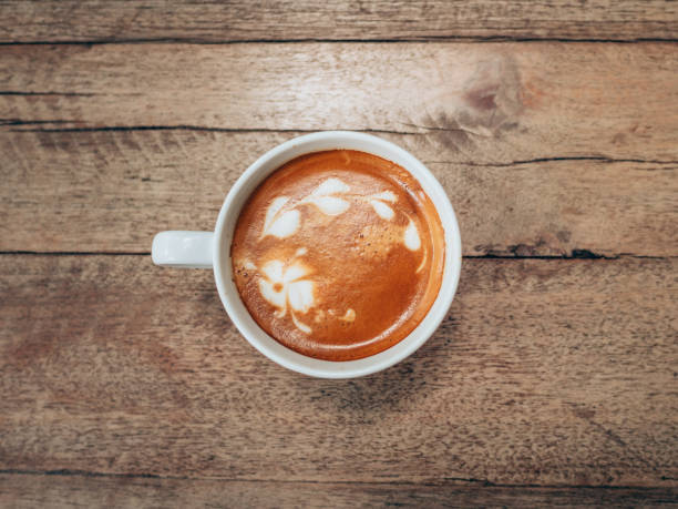 istock top view cup and coffee on wooden table 690667150