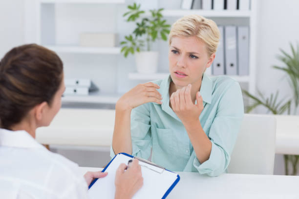 istock Unhappy patient speaking with doctor 690667236