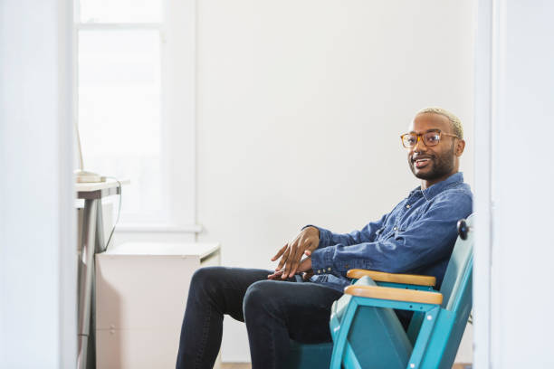 istock Young man with nose ring waiting for job interview 690672570