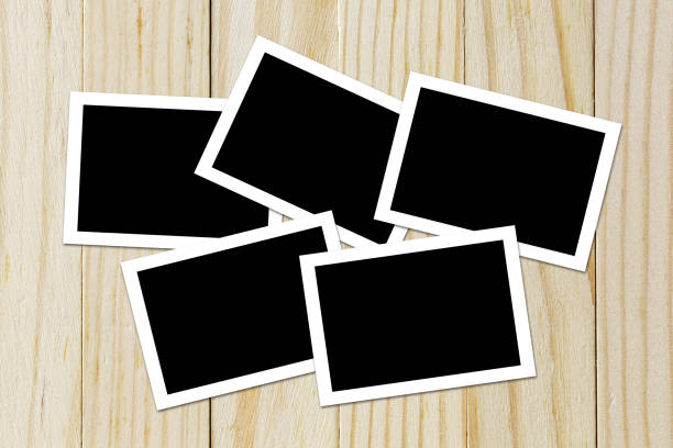 istock Photo frame blank on wood background with space 690672604