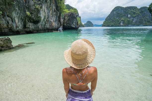 istock Blond girl enjoying exotic vacations in Thailand 690672716