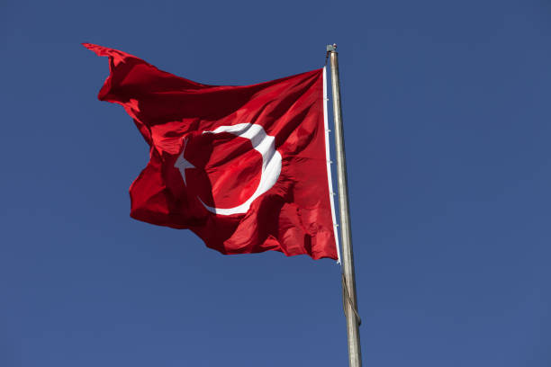 istock Sunlight Turkish flag waving in wind at sunny day 690675500