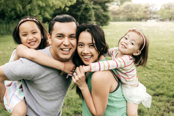 istock Happy family having fun outdoor 690675888