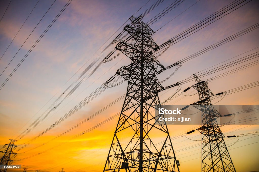 Electric power lines at sunset Power Line Stock Photo