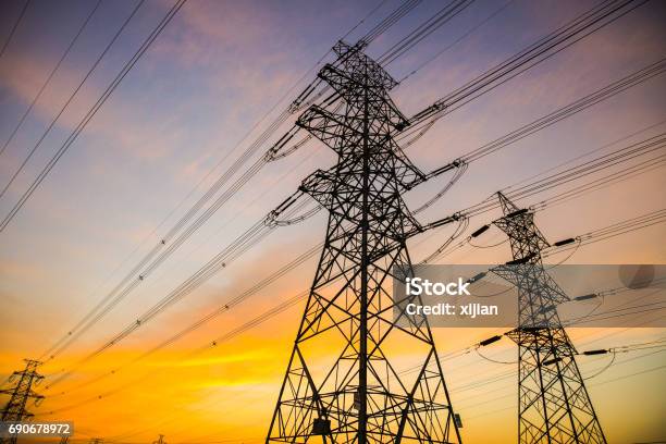 Electric Power Lines At Sunset Stock Photo - Download Image Now - Power Line, Electricity, Electricity Pylon