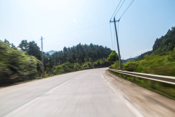 istock concrete road in the sunny day with trees in sides 690687250