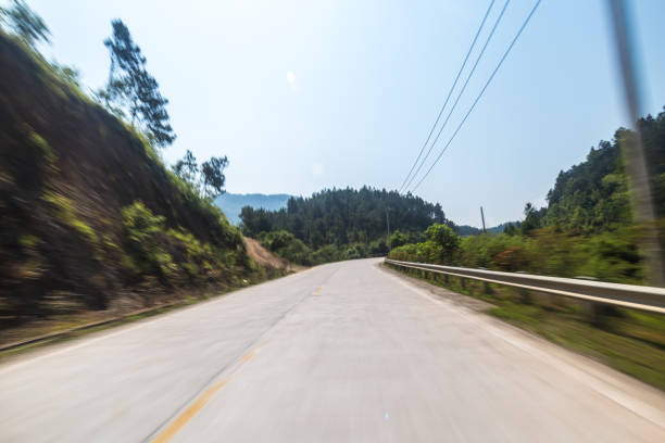 istock concrete road in the sunny day with trees in sides 690687314