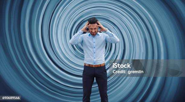 Businessman Against Vortex Background Stock Photo - Download Image Now - Vertigo, Backgrounds, Men