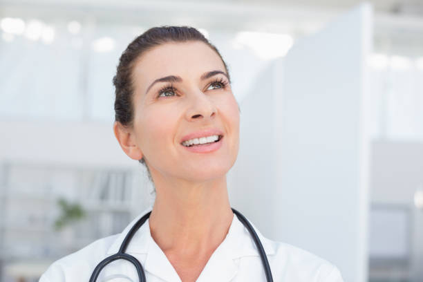 istock Smiling doctor looking at top 690690368
