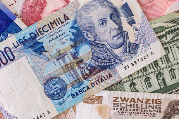 Italian Lira Italian Lira banknote on old european currencies dutch guilders stock pictures, royalty-free photos & images