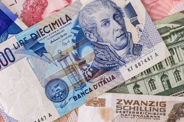 Italian Lira banknote on old european currencies