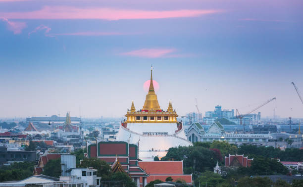 istock Golden mountain or Wat sraket with sunset background. 690699504