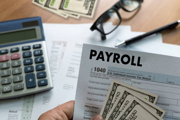 PAYROLL Businessman working Financial accounting concept PAYROLL Businessman working Financial accounting concept paycheck photos stock pictures, royalty-free photos & images