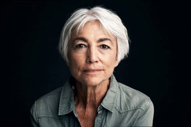 The changes in life are inevitable Studio portrait of a senior woman against a black background grave stock pictures, royalty-free photos & images